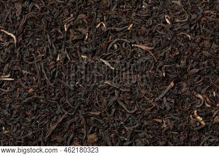 Dried Ostfriesen tea leaves full frame close up as background 