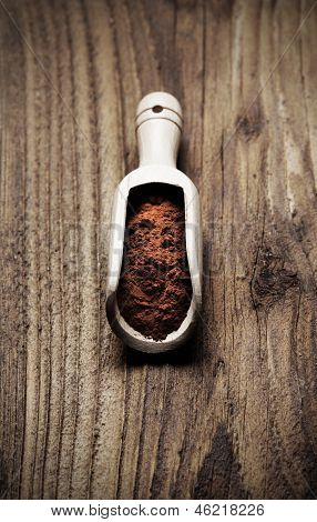 Wooden Spoon Full Of Cocoa Powder