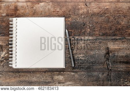 Blank Notebook On Vintage Wooden Table. Mockup Notebook On Old Rustic Desk. Mockup Blank Notebook An