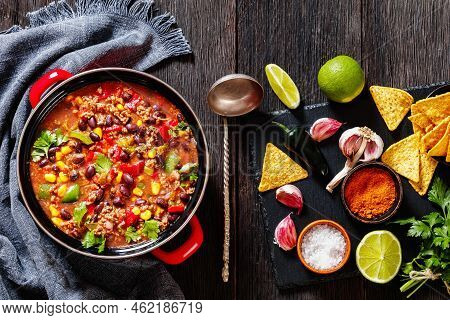 Taco Soup Of Ground Beef, Tomatoes, Chopped Green Chilis, Onions, Corn, Red Beans And Taco Seasoning
