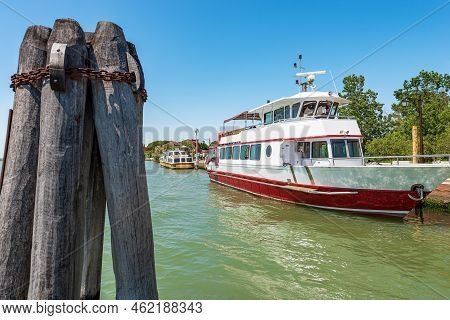 Two Ferries Moored In The Port Of The Torcello Island, Venetian Lagoon, Venice, Unesco World Heritag