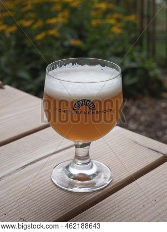 Beveren, Belgium, 31 July 2022, The Blond House Beer Bonapart From Fort Liefkenshoek In A Round, Sph
