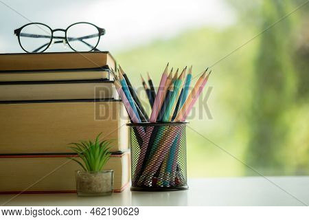 Object Education Green Nature Background With Stack Of Ancient Books Or Old Bible, Open Paper Book O
