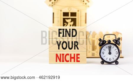 Find Your Niche Symbol. Concept Words Find Your Niche On Wooden Blocks. Black Alarm Clock. Beautiful