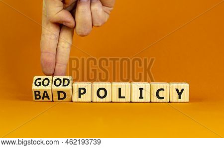 Good Or Bad Policy Symbol. Businessman Turns Wooden Cubes And Changes Words 'bad Policy' To 'good Po