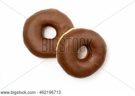 Two Donuts -tasty Dessert With Chocolate Glossy Glaze In A Plate, Isolated On White Background. One 
