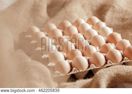 Fresh Organic Chicken Eggs In Carton Pack Or Egg Paper Container On A Sacking. Zero Waste Packaging 