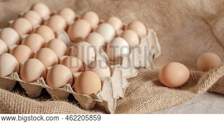 Fresh Organic Chicken Eggs In Carton Pack Or Egg Paper Container On A Sacking. Zero Waste Packaging 