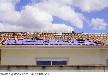 Roof Home Covered With A Tarp Waiting For The Roofing Company To Fix After Thunderstorm