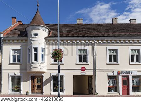 Estonia, Viljandi, September, 2022: Beautifully Renovated Old House With A Turret And Brown Tiles In