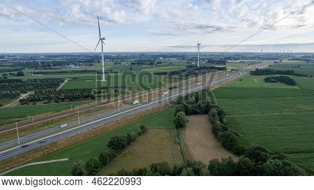 Brecht, Belgium, 6th Of July, 2022, Panoramic Aerial Drone View Of Wind Farm Or Wind Park, With High