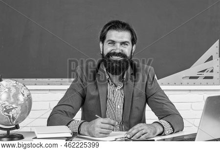 Pure Smile. Studying Online. Informal Education. Male Student Sit In School Classroom On Lesson With