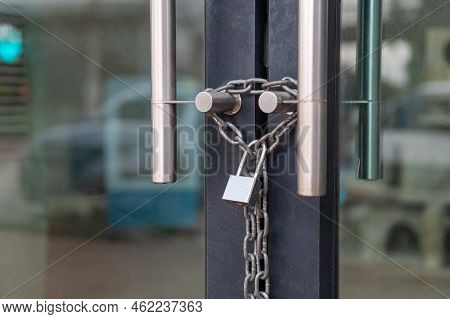 Generic Storefont Door Chained Shut And Locked With A Chain An Padlock