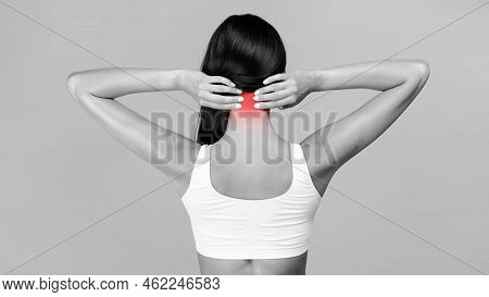 Rear Back View Of Young Woman Touching Inflammated Zone On Her Neck, Suffering From Cervical Osteoch