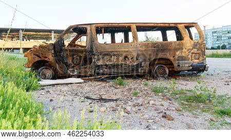 Damaged And Destroyed Civilian Car With Shrapnel Holes From Russian Missile In A War Zone In Kharkiv