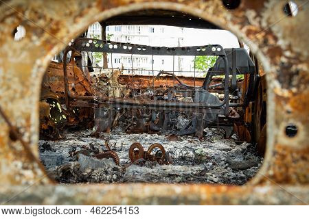 Damaged And Destroyed Civilian Car With Shrapnel Holes From Russian Missile In A War Zone In Kharkiv