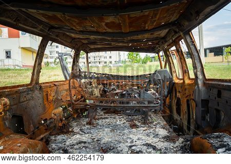 Damaged And Destroyed Civilian Car With Shrapnel Holes From Russian Missile In A War Zone In Kharkiv
