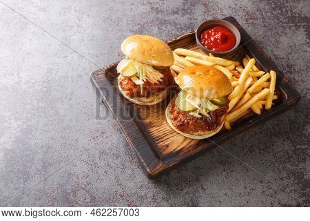 Nashville Hot Chicken Is A Deep-fried Chicken Slathered In A Spicy Paste And Served On Bun With Pick