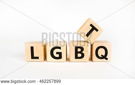 Lgbtq Symbol. Concept Word Acronym 'lgbtq' On Wooden Cubes. Beautiful White Table, White Background.