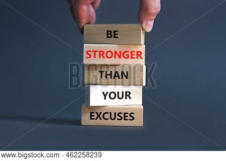Be Stronger Symbol. Concept Words Be Stronger Than Your Excuses On Wooden Blocks On A Beautiful Grey