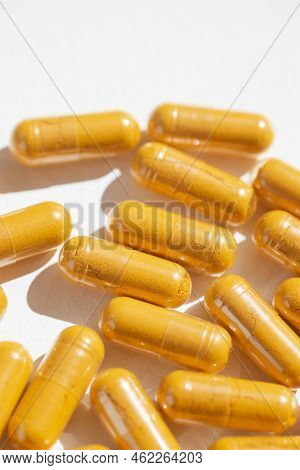 Turmeric Plus Black Pepper Extract Gelatin Capsule Close Up Top View. Herbal Supplement Organic Curc