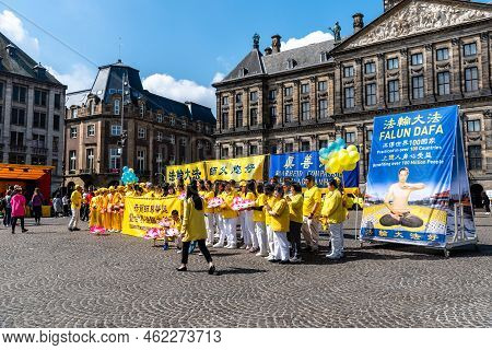 Amsterdam, Netherlands - May 7, 2022: Falun Dafa Practitioners During Protest Day In Dam Square