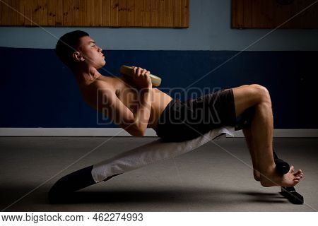 Shirtless 19 Year Old Teenage Boy Doing Situps With Extra Weight