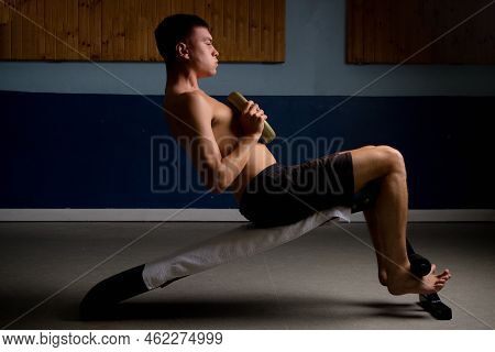 Shirtless 19 Year Old Teenage Boy Doing Situps With Extra Weight