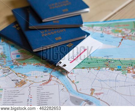 Passport And Note With Covid-19 Inscription. Coronavirus Disease Outbreak. Travelling In Epidemic Pe