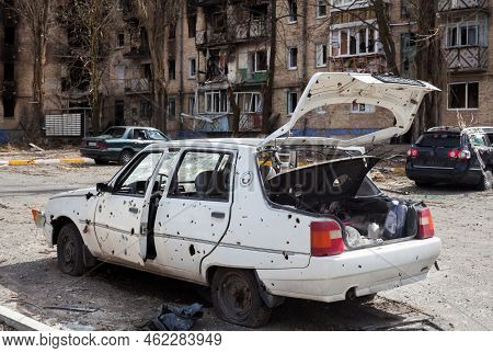 Irpin, Kyiv Region, Ukraine -  April 12, 2022: Russian Invasion Of Ukraine. Car Damaged By Russian S