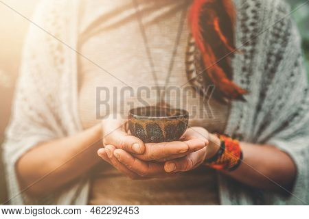 Cacao Ceremony, Heart Opening Medicine. Ceremony Space. Cacao Cup In Womans Hand.