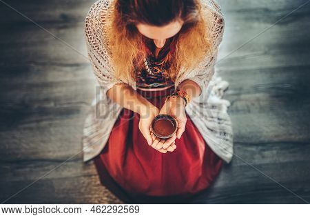 Cacao Ceremony, Heart Opening Medicine. Ceremony Space. Cacao Cup In Womans Hand.