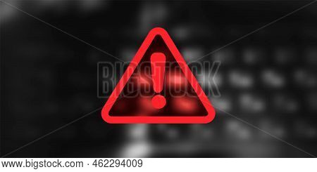 Warning Symbol With Exclamation Mark On Blured Background With Keyboard