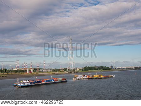 Antwerpen, Flanders, Belgium - July 10, 2022: Industry Along Scheldt River. Container Barges Loaded 