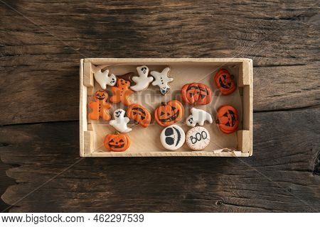 Halloween Gingerbread Cookies In Plate On Wooden Background. Pumpkins, Ghosts And Gingerman Gingerbr