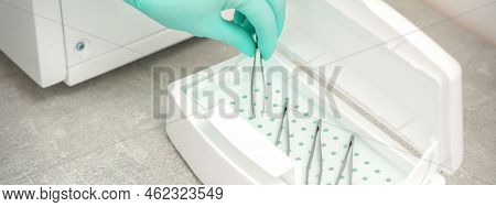 Hand Disinfects Tweezers With Cleaning Systems For Medical Instruments. Ultrasonic Cleaner