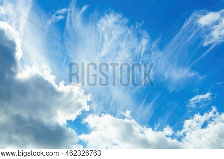 Blue Sky With White Cirrus And Dark Nimbostratus Clouds