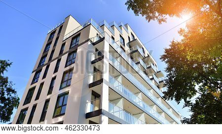 Modern Residential Building With New Apartments In A Green Residential Area. Eco Architecture. Green