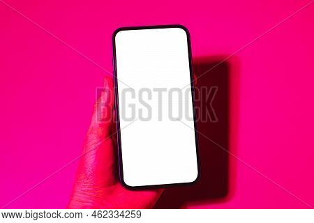 Mobile Phone Mockup In Pink And Purple Light.design Template For Concept Design. Modern Communicatio