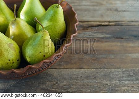 Pears On A Wooden Background. Fruit Harvest. Autumn Still Life. Pear Variety Bera Conference.