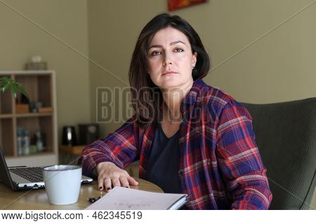 Dispassionate, Silent, Stressed Dark-haired Businesswoman Working In Office With Laptop. Frustration