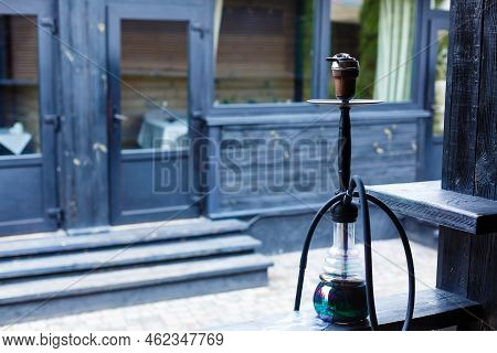 Hookah Smoking At A Party Concept. Hookah Stands On The Street At The Table. Smoking Concept. Tradit