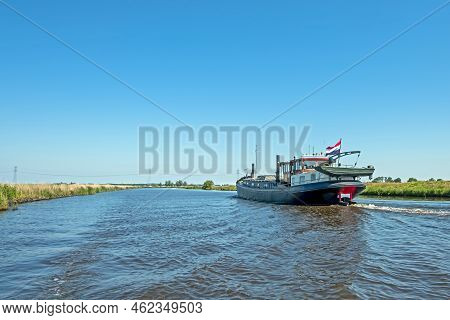 Freighter On The Frisian Canals In Friesland The Netherlands