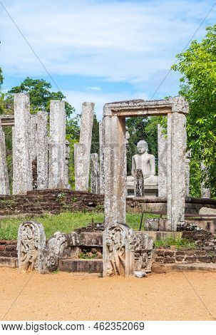 Thuparama Buddha Statue And The Stone Columns. World Heritage Site In The Sacred City Of Anuradhapur