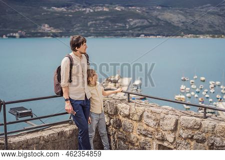 Father And Son Tourists In Herceg Novi Old Town. Historical And Touristic Center Of Herceg Novi. Mon