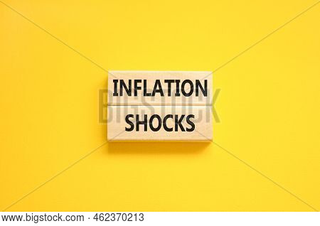 Inflation Shocks Symbol. Concept Words Inflation Shocks On Wooden Blocks. Beautiful Yellow Table Yel