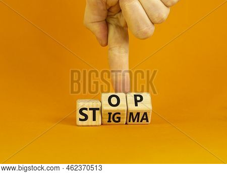 Stop Stigma Symbol. Concept Words Stop Stigma On Wooden Cubes. Businessman Hand. Beautiful Orange Ta