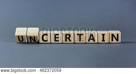 Certain Or Uncertain Symbol. Turned Wooden Cubes And Changed The Concept Word Uncertain To Certain. 