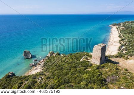Ancient ruins of Apollonia tower from Byzantine era and beautiful coast of Greece washed by Thracian sea. The landmark is loicated on old old Kavala-Thessaloniki motorway