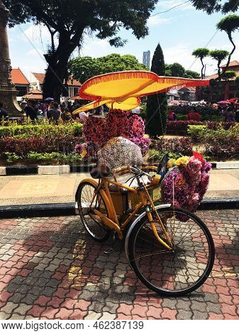Malacca, Malaysia's Characteristic Means Of Transportation: Human Tricycle Floats.